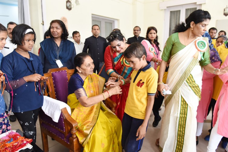 governor anandiben patel tied rakhi to children