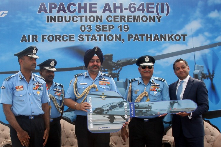 b.s. dhanoa at the induction ceremony of indian air force ah-64e apache attack helicopters