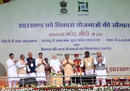 narendra modi laying the foundation stone of several development projects