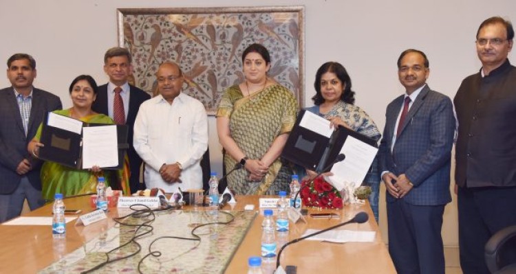 thaawar chand gehlot and smriti irani at the signing ceremony