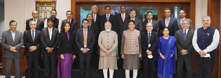 narendra modi in a group photograph with the ceos of companies from various sectors of industry