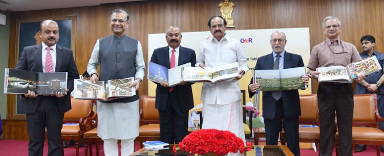 venkaiah naidu releasing the coffee table book of delhi airport