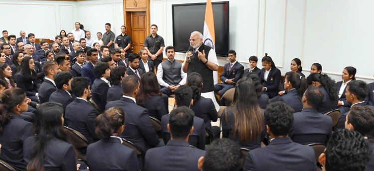 prime minister narendra modi medal while talking to the winners