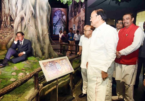 venkaiah naidu looking at the life-size statue of dr. b.r. ambedkar