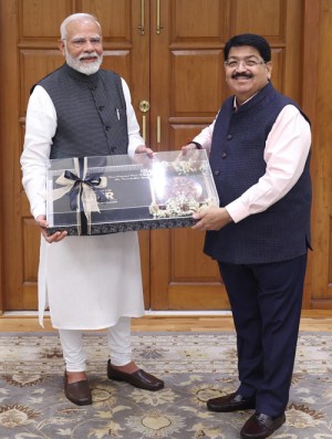 parimal nathwani presented the book to the prime minister