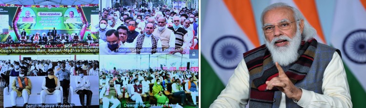 narendra modi addressing the kisan sammelan in madhya pradesh, via video conferencing