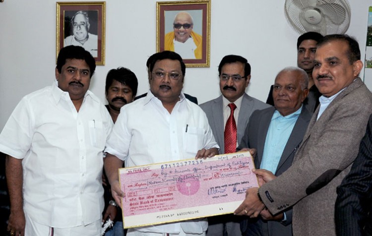 m. k. alagiri being presented a dividend cheque